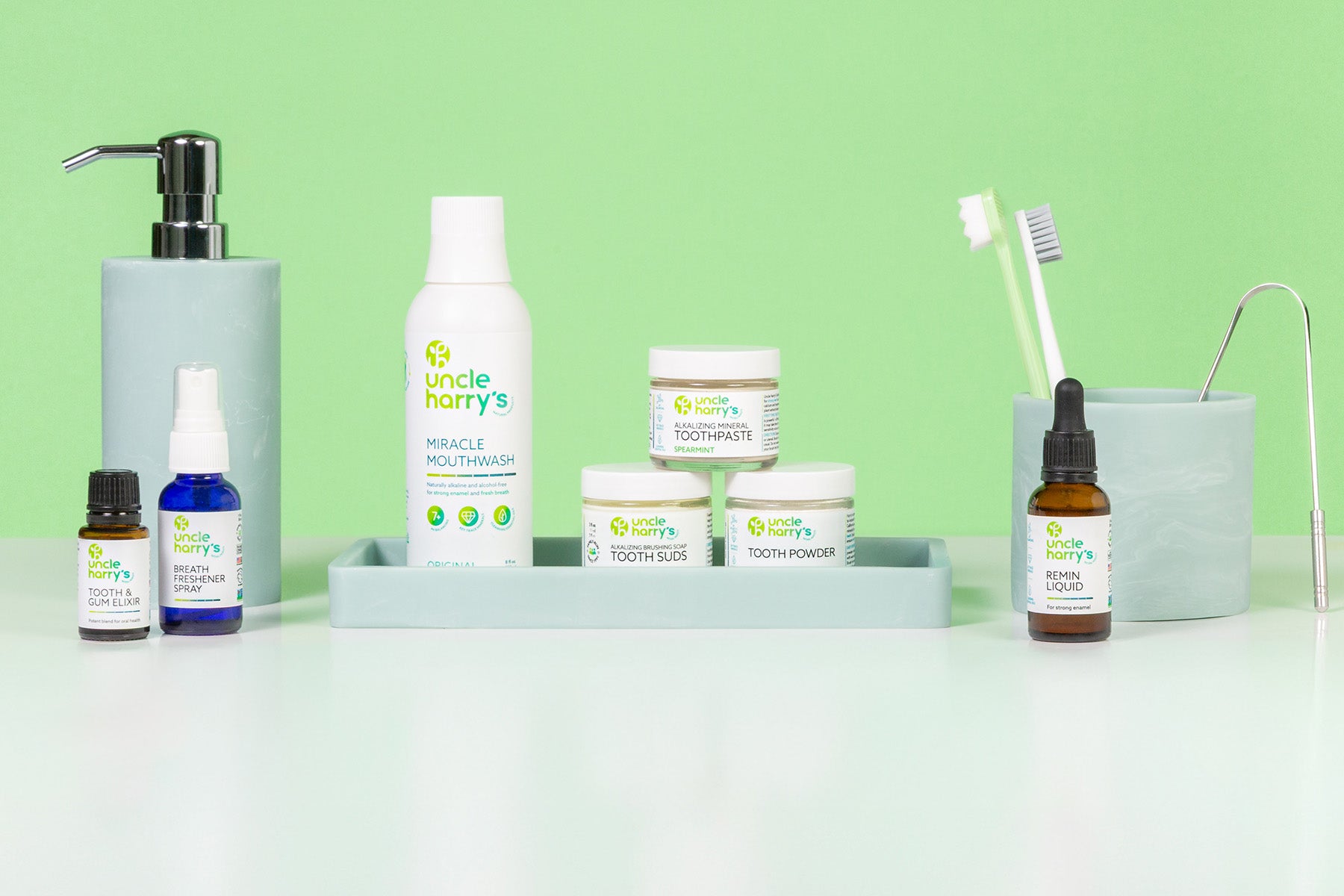 Collection of Uncle Harry's Oral Care on a white surface with a green background