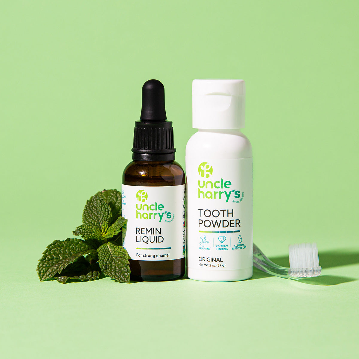 Uncle Harry's Remin Liquid and Tooth Powder on a green background