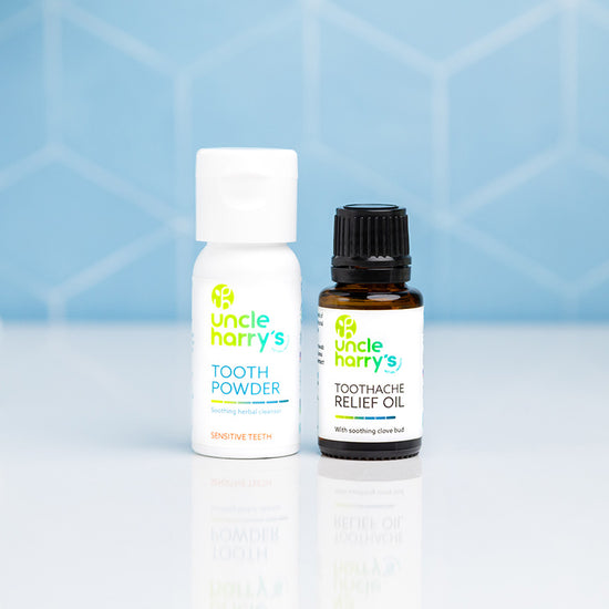 Bathroom scene with Uncle Harry's Tooth Powder for Sensitive Teeth and Toothache Relief Oil